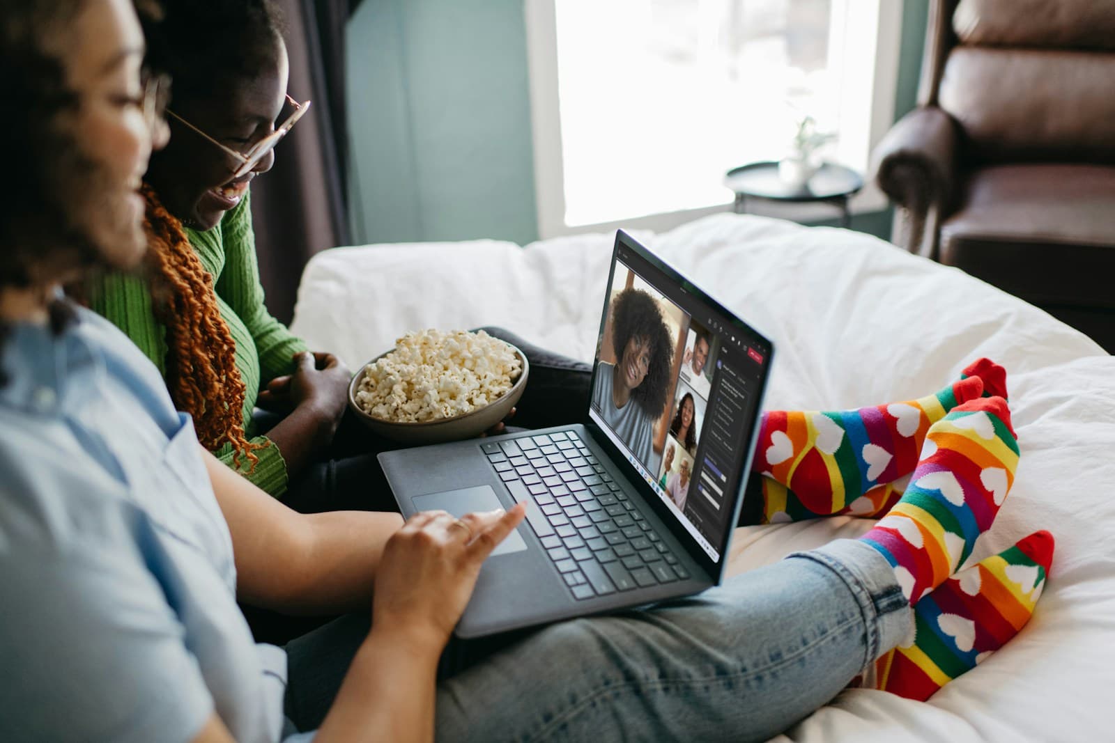 Couple running a home business together on a laptop